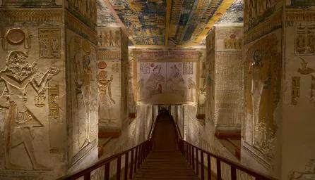 A view inside a pyramid corridor, with walls covered in hieroglyphics and ancient artwork