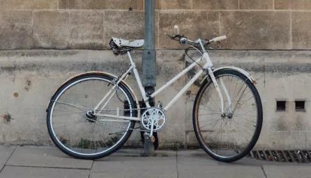 Bike leaning against wall in Cambridge