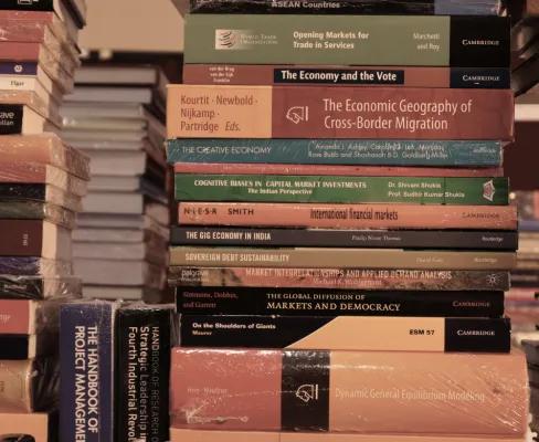 Multiple stacks of non-fiction books