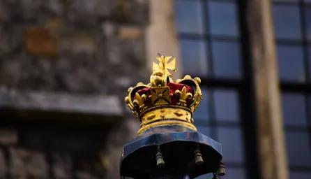 A crown placed on a podium
