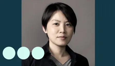 Asian woman with short hair looking at camera