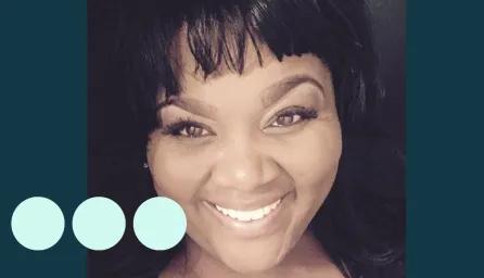Black woman taking selfie, smiling for photo 