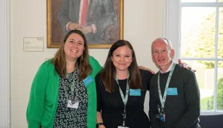 Professional services team smiling at camera