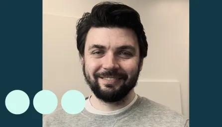 Man with dark hair and facial hair