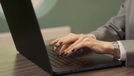 Woman typing on laptop