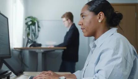Support team typing at computers