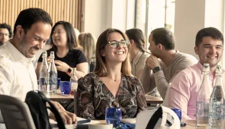 Groups of smiling students in an academic environment