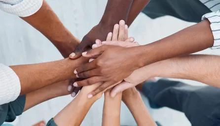 image of hands overlapped together 