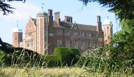 Photo of Madingley hall and its gardens. 