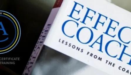 Coaching book with a coaching accreditation badge. 