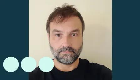 Head and shoulders photograph of man with beard