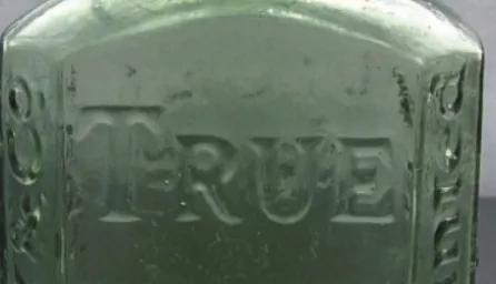 3 medical glass bottles, close up. 