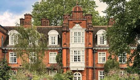 Newnham College façade on a sunny day.