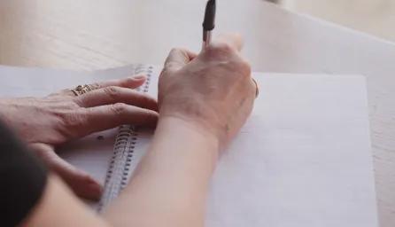 hand writing on notebook 