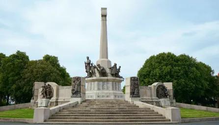 Statues of armed soldiers, unarmed men, women and children