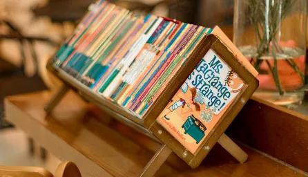 Children books on a small wooden stand