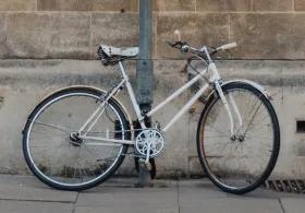 Bike leaning against wall in Cambridge