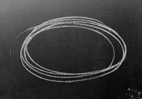 chalk circle drawn on a blackboard