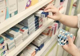 Person checking inventory of pharmacy products