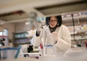 Scientist working in a lab with biological samples