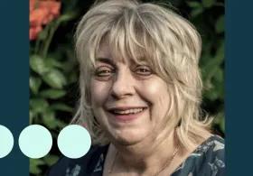 Image of older woman, smiling at camera