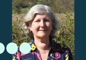 Older woman with silver short wavy hair 