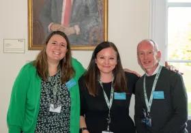Professional services team smiling at camera