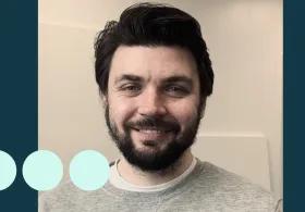 Man with dark hair and facial hair