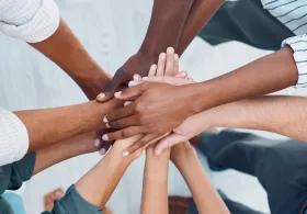 image of hands overlapped together 