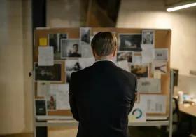 Back View of a Detective in a Black Suit