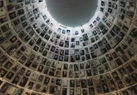 Walls covered in black and white portraits at the Hall of Names in the Yad Vashem Holocaust Memorial Site.