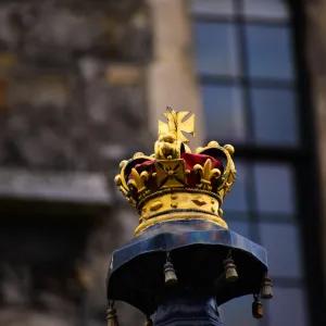 A crown placed on a podium