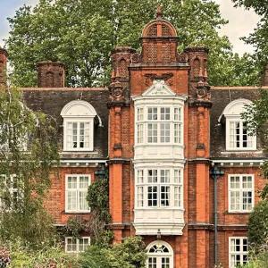 Newnham College façade on a sunny day.