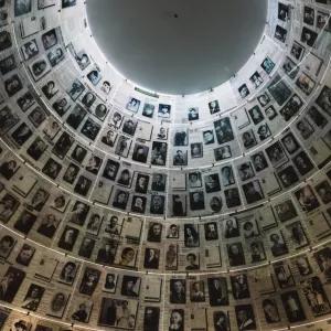 Walls covered in black and white portraits at the Hall of Names in the Yad Vashem Holocaust Memorial Site.