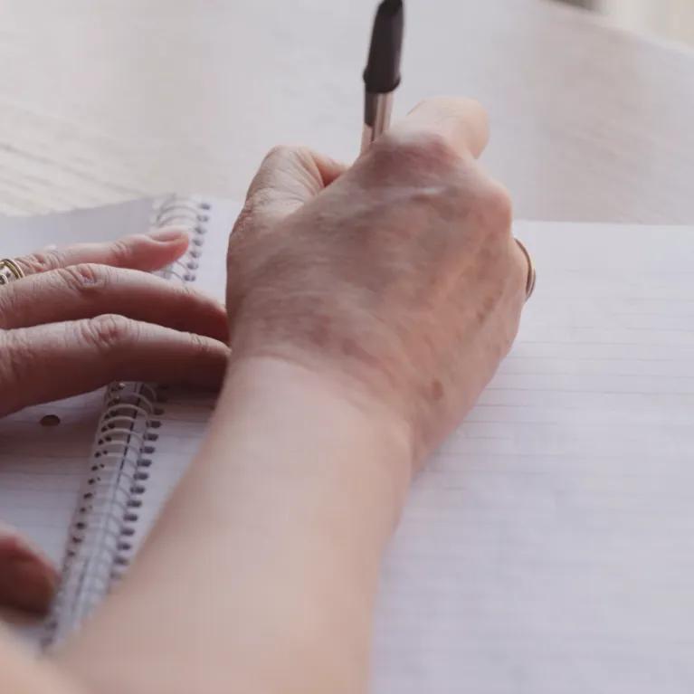 hand writing on notebook 