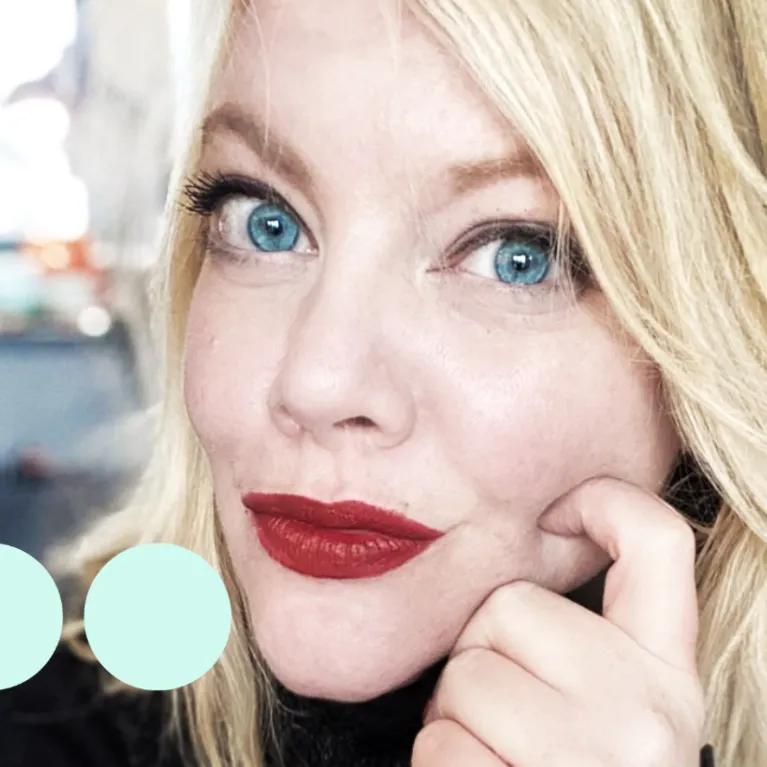 Women with red lipstick looking to camera