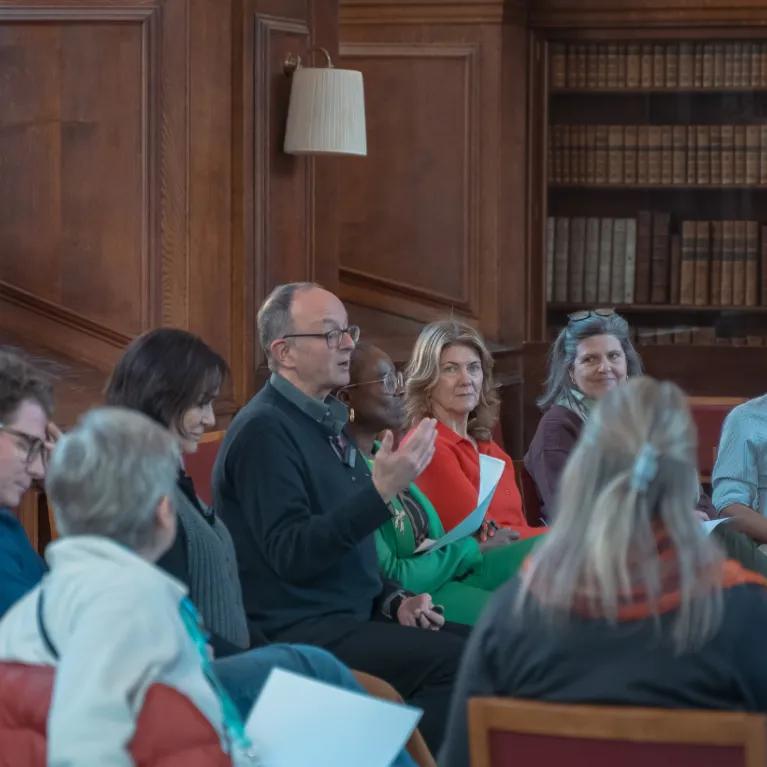 People in group speaking to eachother