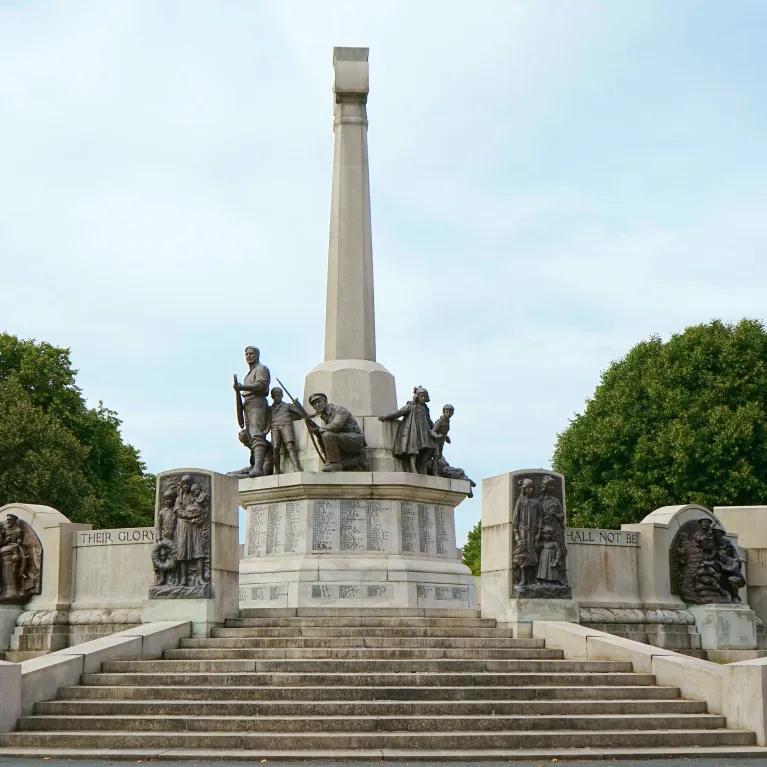 Statues of armed soldiers, unarmed men, women and children