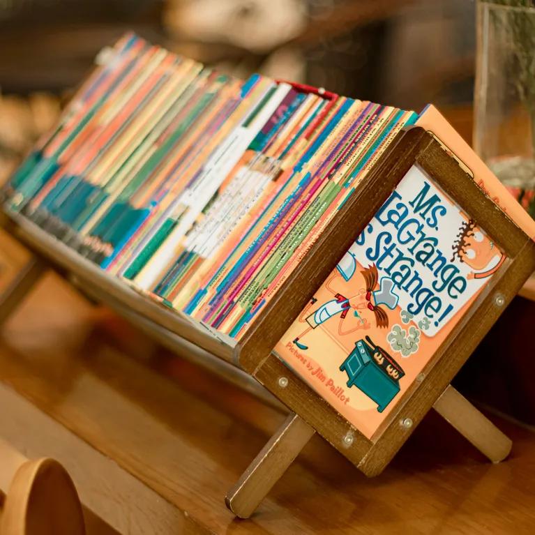 Children books on a small wooden stand