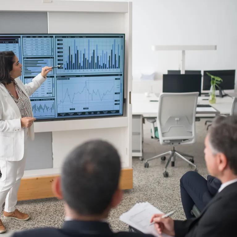 A dashboard presentation to a group of people