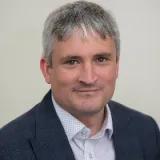 Dr Christopher Huggins