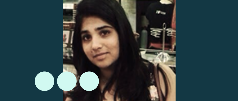 Image of woman with long black hair looking directly into camera