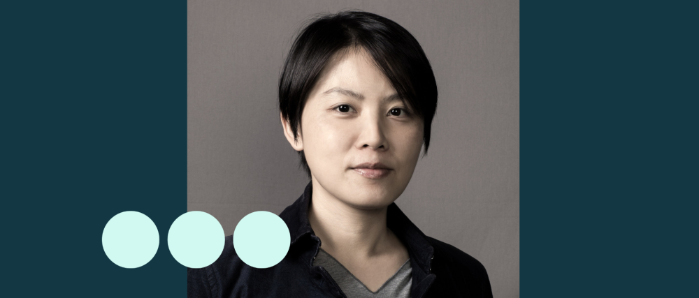Asian woman with short hair looking at camera