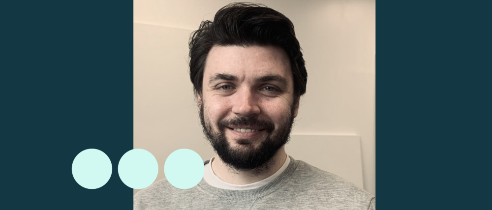 Man with dark hair and facial hair